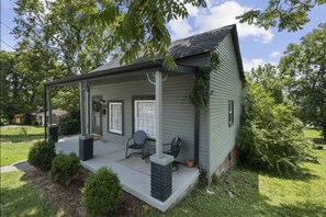 Front porch with seating to enjoy outside.