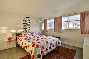 Bedroom #2 with queen bed and city views.
