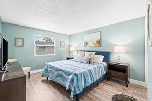 Relax in the spacious master bedroom featuring a plush king-size bed for ultimate comfort! 🛏️✨