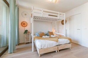 Bedroom with 2 single beds and 1 double bed