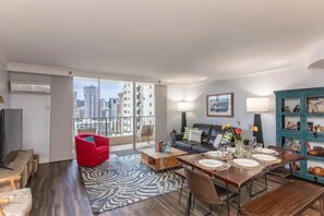 Living Room with pull out sofa and Smart TV. Dining table seats six comfortably.