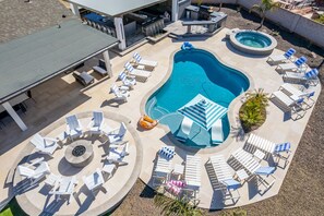 Beautiful backyard with heated pool, spa, fire pits, mini golf, and more!!