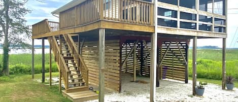 Side view of the cottage and deck space with gas grill