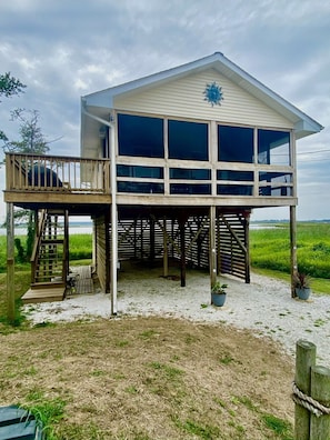 Our coastal cottage - with large side deck and screened in porch for relaxing!