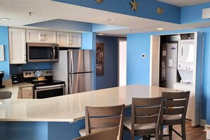  Kitchen with full size Refrigerator, Freezer, Microwave, Stove and essentials needed for your stay. Bar height Chairs for extra seating. 