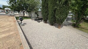 outdoor hangout with grill and fire pit