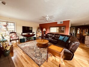 Enjoy the inviting living room with views of Mars Hill the surrounding pines