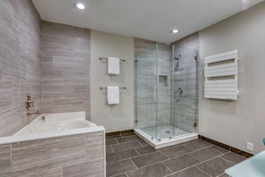 Master bath soaking tub, custom tile & glass shower, towel warmer, double vanity