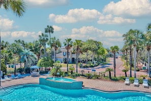 Lush gardening and resort pool with some the Gulf's view