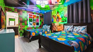 Immersive gamer-themed room with twin/full beds, glowing decor, and bold colors.