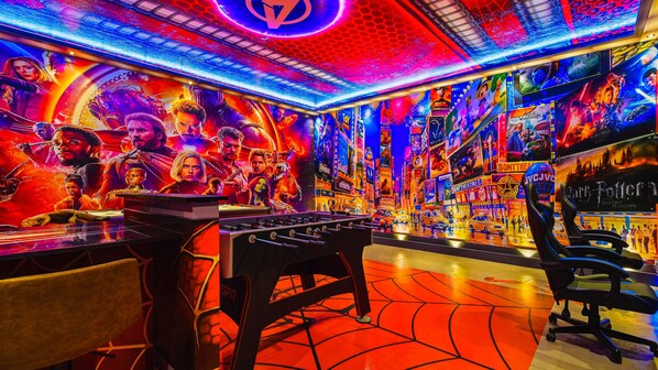 The game room is stylishly furnished with Avengers theme with cool lights.