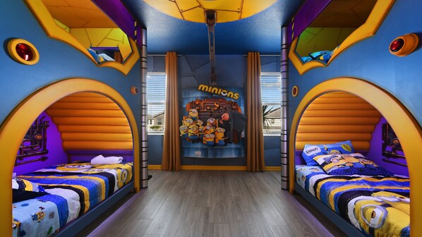 Drift into a peaceful sleep in our cozy Minion inspired bedroom, ensuring a restful night's sleep during your stay.