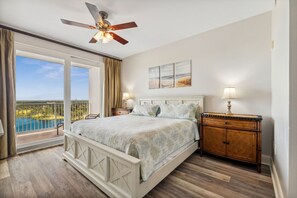 Primary Bedroom with King Size Bed, Flat Screen TV, Ensuite Bathroom, Lake Views and Direct Balcony Access