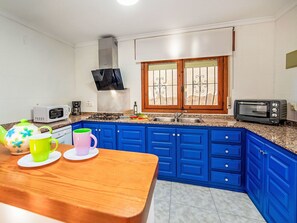 Kitchen, Interior Design, Major Appliance, Cabinetry, Furniture, Countertop, Flooring, Kitchen Appliance, Room, Floor