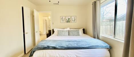 Master bedroom with a king bed