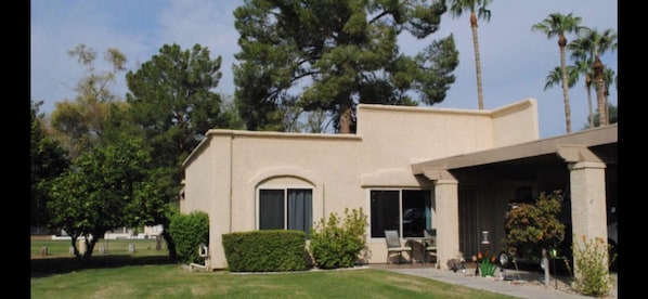 Front door of the Condo with carport 