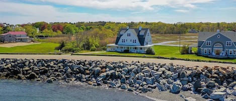 Aerial view - pebble beach across the road, marshland in rear, Chapel Creek left