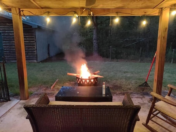 Enjoy a few drinks on the back lawn around a cozy fire