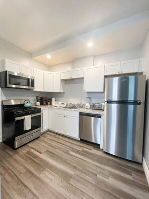 This fully equipped kitchen includes a toaster, drip coffee pot and all cooking utensils and much more! You will find all the cleaning supplies you will need under the sink.