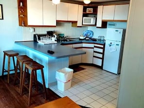 Kiitchenette with Cuboards, Fridge, Microwave, Coffeemaker, etc