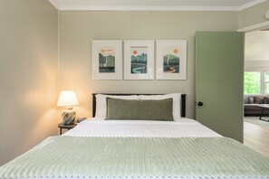 Rest easy in the cozy downstairs bedroom, complete with a queen bed and Nectar mattress, smart TV, and blackout shades for a peaceful night’s sleep.