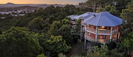 Set amongst the canopy with spectacular ocean and hinterland views.