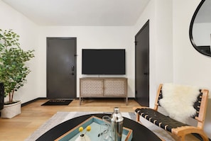 Modern living room with smart TV; stream your favorites.