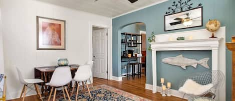 Beautifully decorated entryway with ceiling fan and seating area.