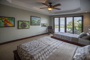 Tropical Room.  First-floor bedroom surrounded by oil paintings.
