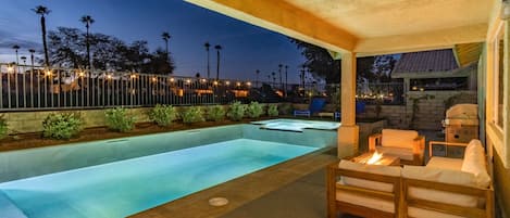The backyard lights up great at night so you can enjoy the pool after sunset!