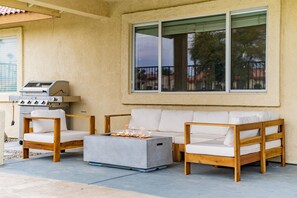 Plenty of comfortable seating around the fire pit to relax at the pool! 