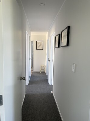 Hallway from living area to bedrooms, bathrooms and laundry 