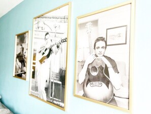 Framed portraits of the iconic Johnny Cash blanket the walls, paying homage to his legendary legacy