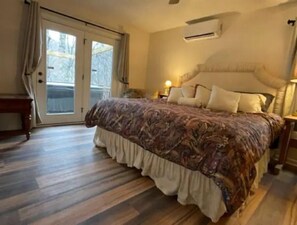 Spacious master bedroom with king bed and private bath overlooks the hot tub 