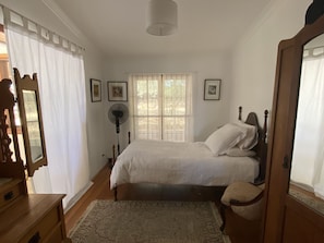 Bedroom 4 - opening to a small sitting area with French doors to back verandah