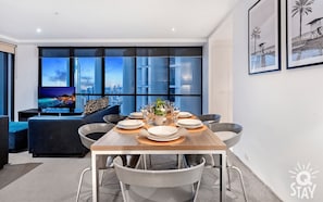 The elegant dining area overlooking the ocean and the city
