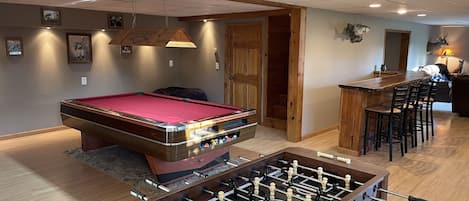 Game room- foosball, 8' slate pool table, dartboard, dry bar, and t.v.