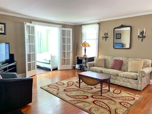 Living room with plenty of seating and a flat screen TV