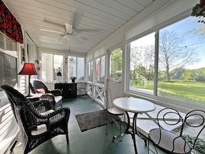 Three season room overlooking the patio and Lake Allegan