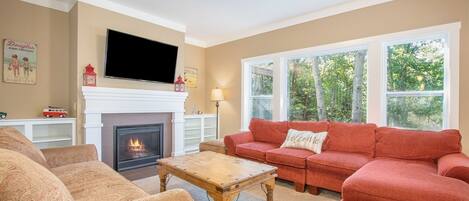 Flat screen TV with DirecTV and a seasonal gas fireplace