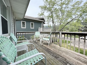 Upper deck with an outdoor table and chairs