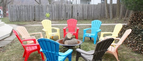 Fire pit with fun chairs to hang out and make s`mores