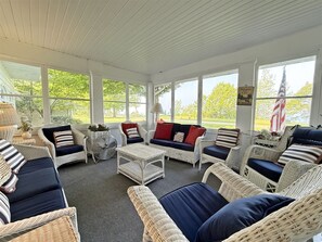 Amazing screen porch on the front of Liberty Bluff with Lake Michigan views