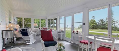 Amazing screen porch on the front of Liberty Bluff with Lake Michigan views