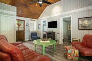 Open floor plan with soaring ceiling in the living room