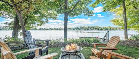 Relax around the fire overlooking Hutchins Lake at The Roost