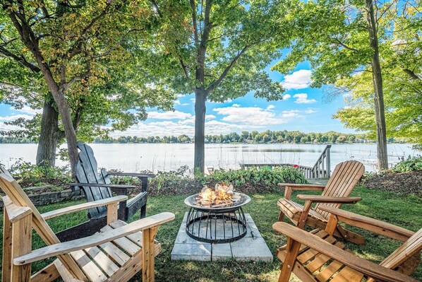 Relax around the fire overlooking Hutchins Lake at The Roost