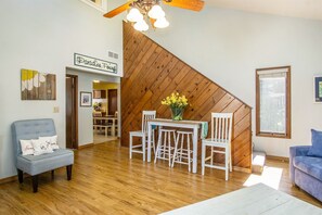 Bright and welcoming living room with soaring ceilings.