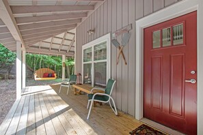 Covered porch with swing to relax in the breeze