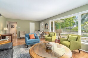 Bright and welcoming living room with plenty of comfortable furniture to relax